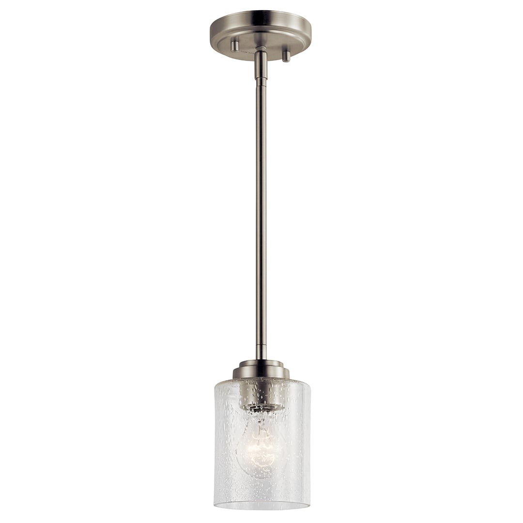 The Winslow 7in; 1 light mini pendant features a classic look with its Brushed Nickel finish and clear seeded glass. Winslow mini pendant is perfect in several aesthetic environments, including traditional and transitional.
