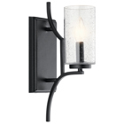 A popular mission fixture gets the designer touch with the 1-light wall sconce in Distressed Black from the Vara collection. The sturdy ironwork supports feature linear detailing and the glass shades have a seeded effect, helping to soften the overall traditional masculine look.