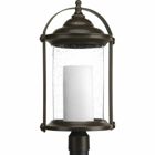 Inspired by traditional lantern styles, Whitacre post lantern incorporates handsome details. Clear seeded glass surrounds an etched opal glass candle diffuser. An Antique Bronze finish complements a variety of exteriors, including Transitional and Traditional and Farmhouse designs.