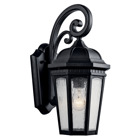 The Courtyard(TM) 17.75in; 1 light outdoor wall light with clear seeded glass Textured Black finish. The Courtyard wall light curls and heritage detail give a distinguished traditional look.