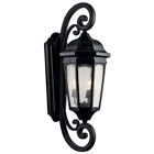The Courtyard(TM) 40.50in; 3 light outdoor wall light with clear seeded glass Textured Black finish. The Courtyard wall light curls and heritage detail give a distinguished traditional look.