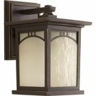 Outdoor one-light small wall lantern with geometric details, umber textured art glass, and an Antique Bronze finish.