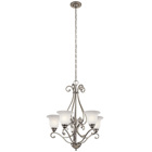 The Camerena(TM) 31.25in. 5 light chandelier features a traditional style with its gently curled metal accents in Brushed Nickel finish and gorgeous bell shaped white scavo glass. The Camerena(TM) chandelier works in several aesthetic environments, including traditional and modern.